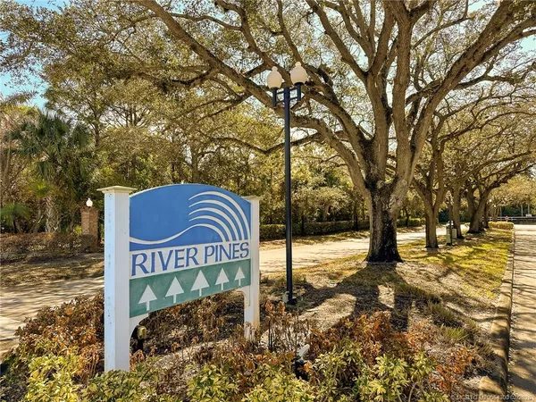 a sign board with a yard