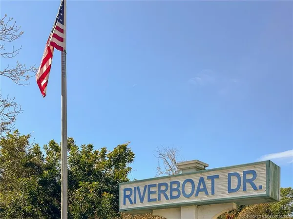 a street sign on a pole on a street