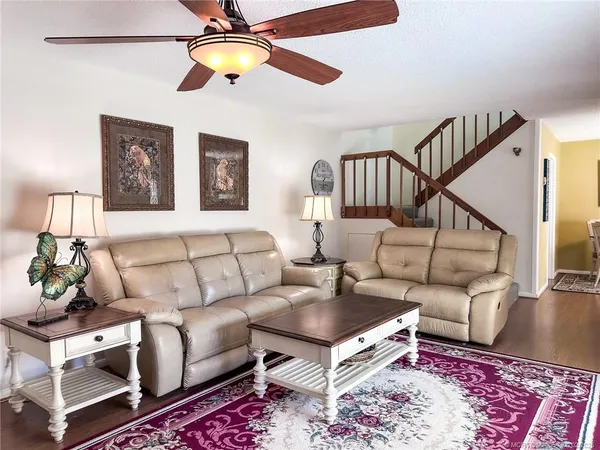 a living room with furniture and a rug