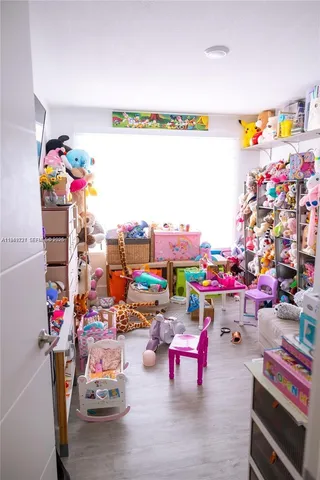 an outdoor space with lots of furniture and toys