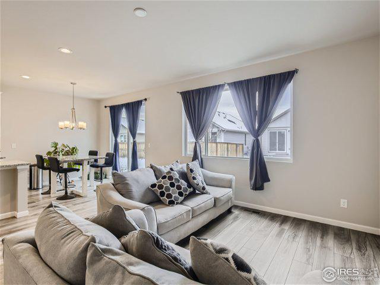 555 Ranchhand Drive Berthoud, CO 80513 - Photo 6 of 11 a living room with furniture and a large window