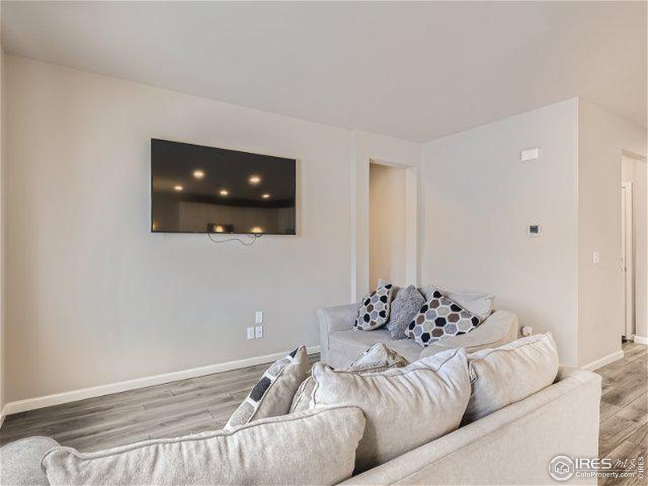 555 Ranchhand Drive Berthoud, CO 80513 - Photo 7 of 11 a living room with furniture and flowers
