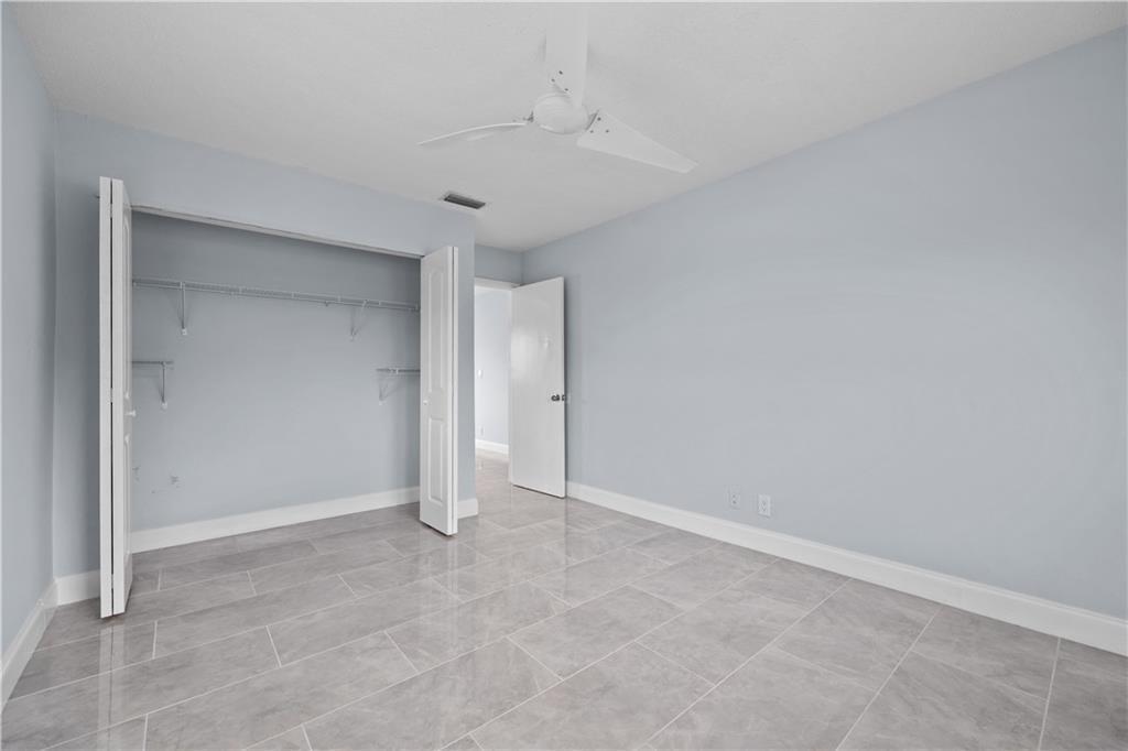 260 Northwest 19th Street, Unit 290 Boca Raton, FL 33432 - Photo 14 of 18 wooden floor in an empty room