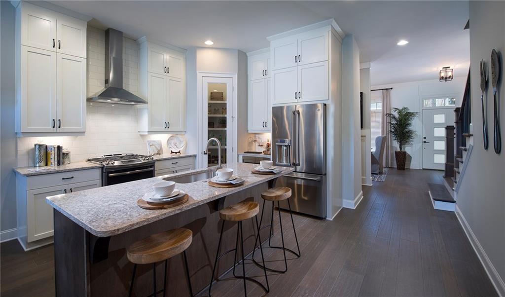 249 Franklin Road Atlanta, GA 30342 - Photo 1 of 1 Tyndale 1 floor plan with kitchen in the middle of the home. Model photograph is representative of home to be built.