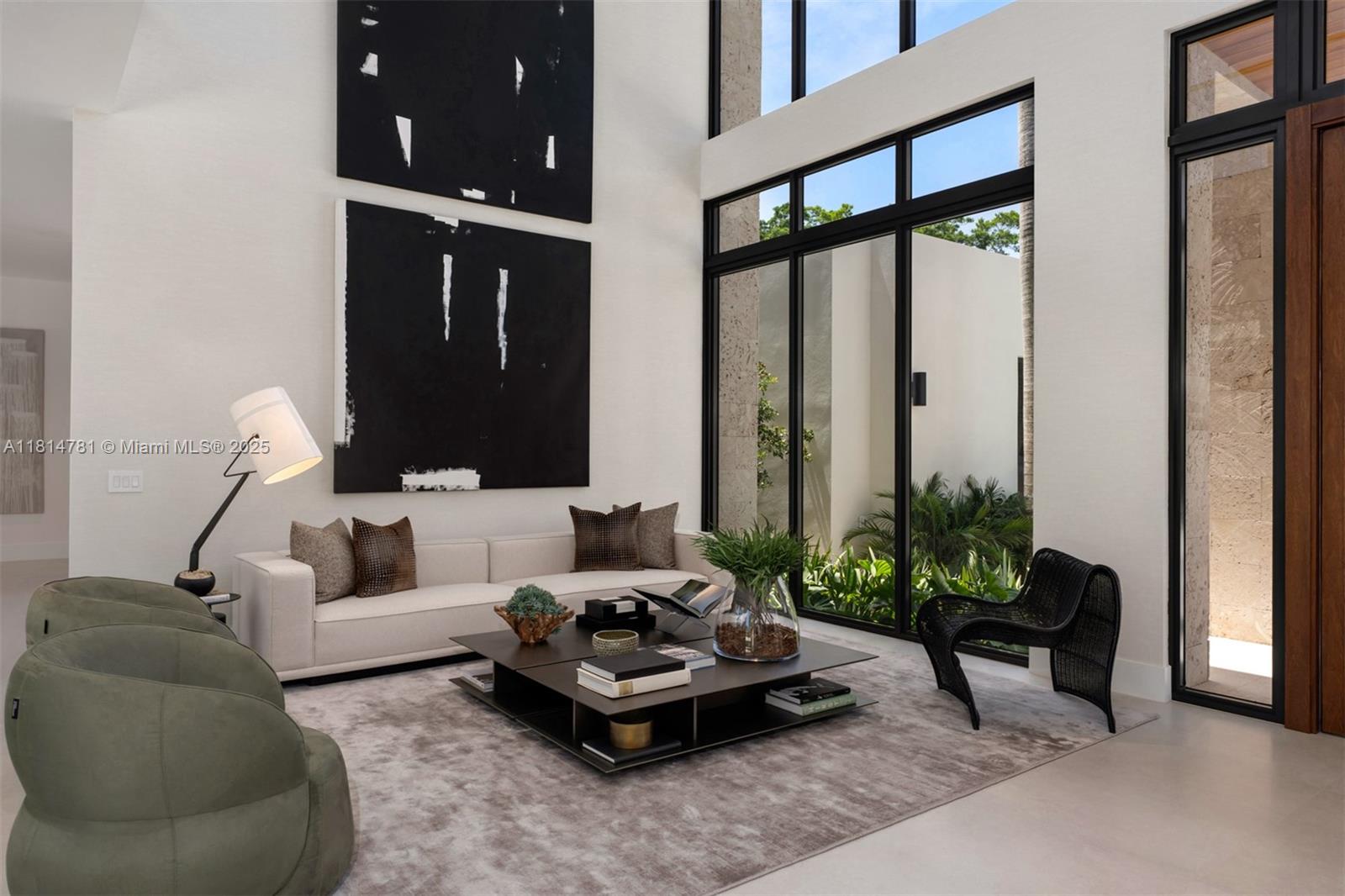 6730 Southwest 115th Street Pinecrest, FL 33156 - Photo 12 of 77 a living room with furniture and a potted plant