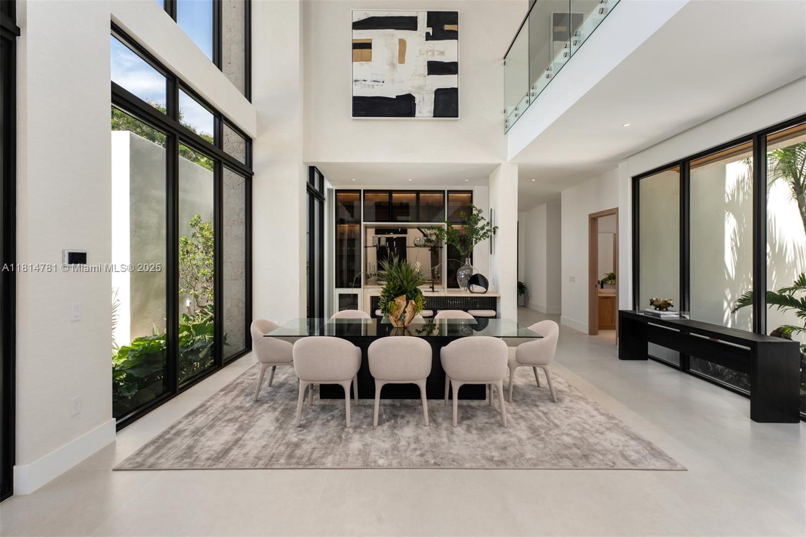 6730 Southwest 115th Street Pinecrest, FL 33156 - Photo 13 of 77 a living room with furniture and large windows
