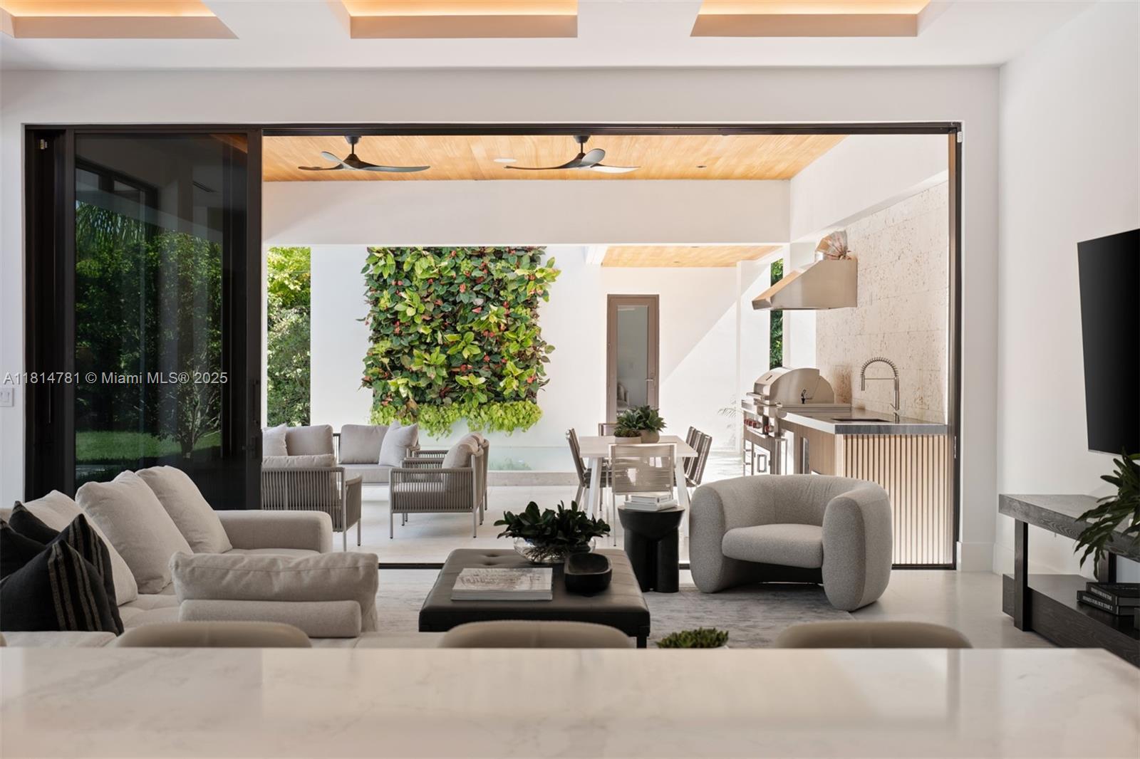 6730 Southwest 115th Street Pinecrest, FL 33156 - Photo 22 of 77 a living room with furniture and a flat screen tv