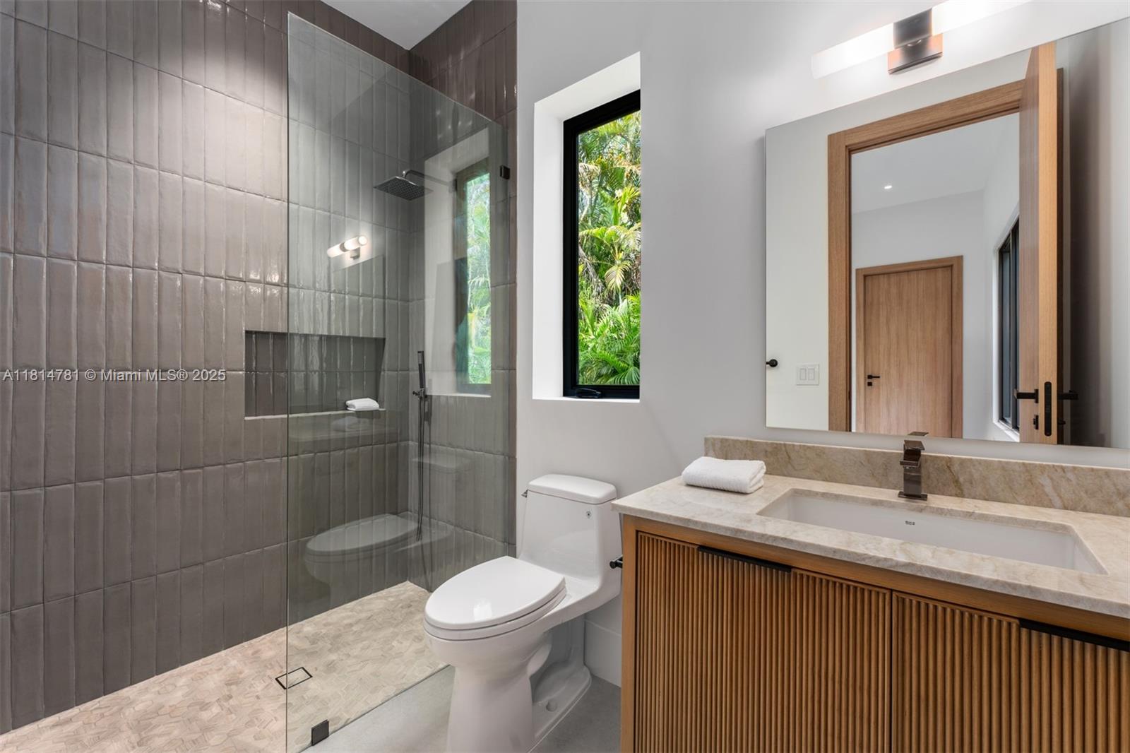 6730 Southwest 115th Street Pinecrest, FL 33156 - Photo 33 of 77 a bathroom with a sink a toilet and shower