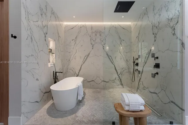 a kitchen with a table chairs refrigerator and cabinets