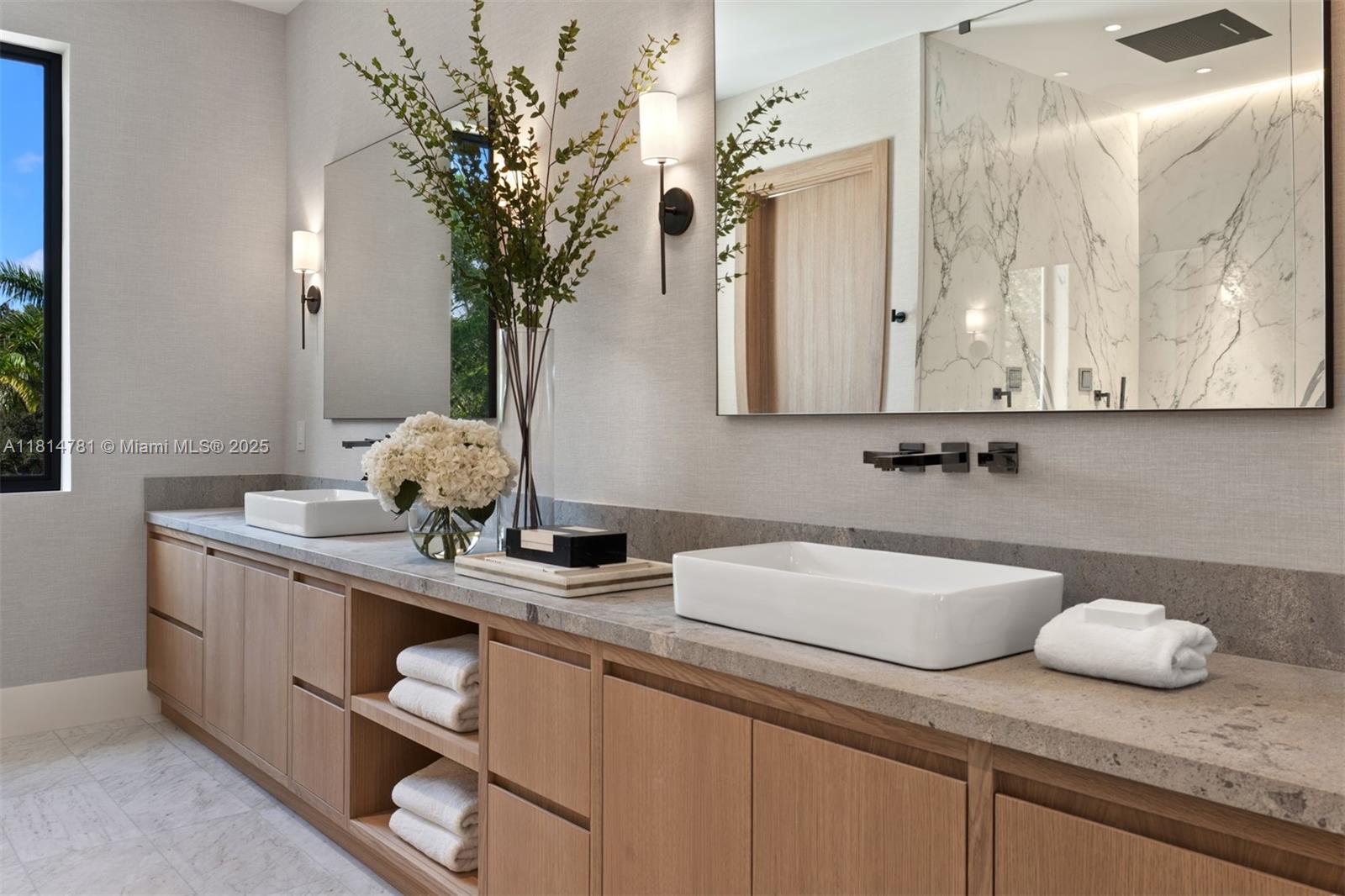 6730 Southwest 115th Street Pinecrest, FL 33156 - Photo 40 of 77 a bathroom with a granite countertop sink a mirror and cabinets