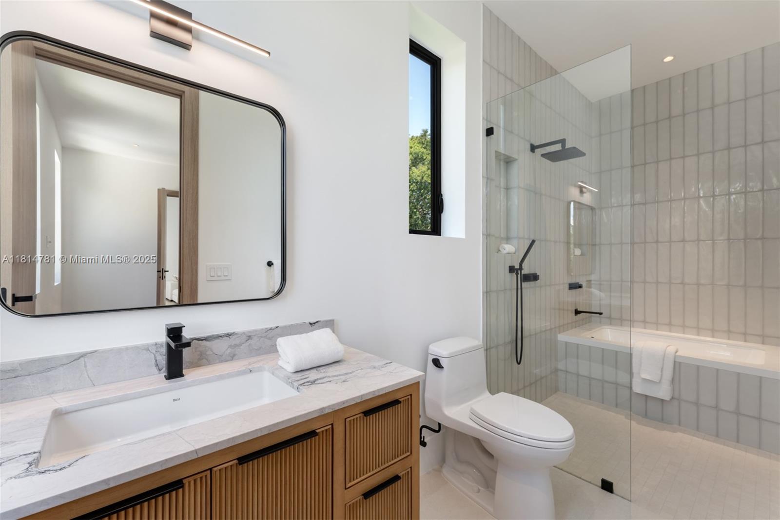 6730 Southwest 115th Street Pinecrest, FL 33156 - Photo 45 of 77 a bathroom with a sink a toilet and shower