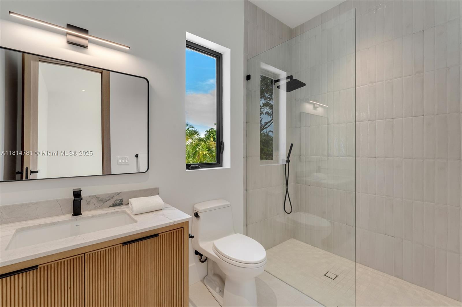 6730 Southwest 115th Street Pinecrest, FL 33156 - Photo 46 of 77 a bathroom with a sink toilet and shower