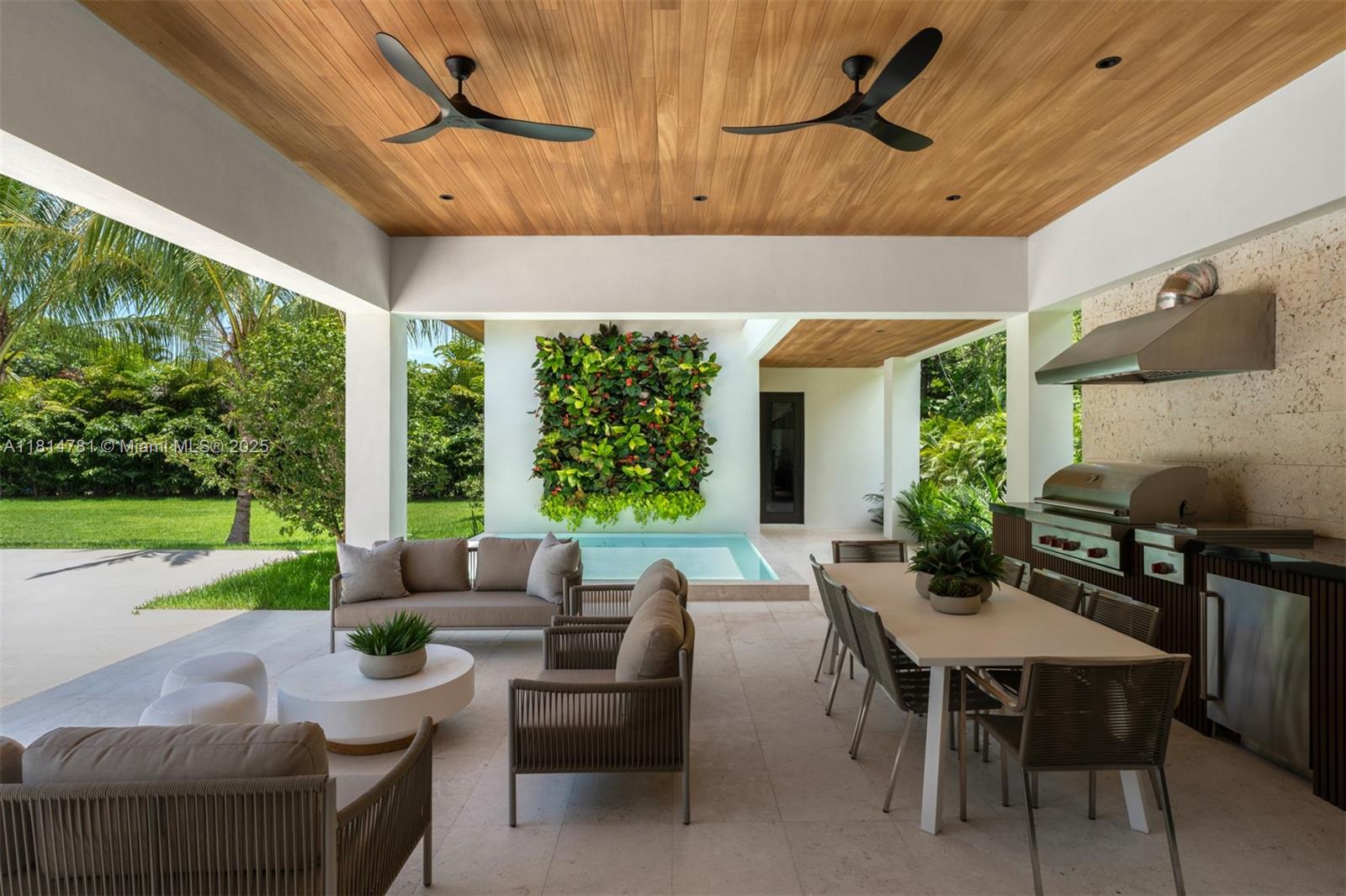 6730 Southwest 115th Street Pinecrest, FL 33156 - Photo 47 of 77 a view of a patio with a dining table and chairs