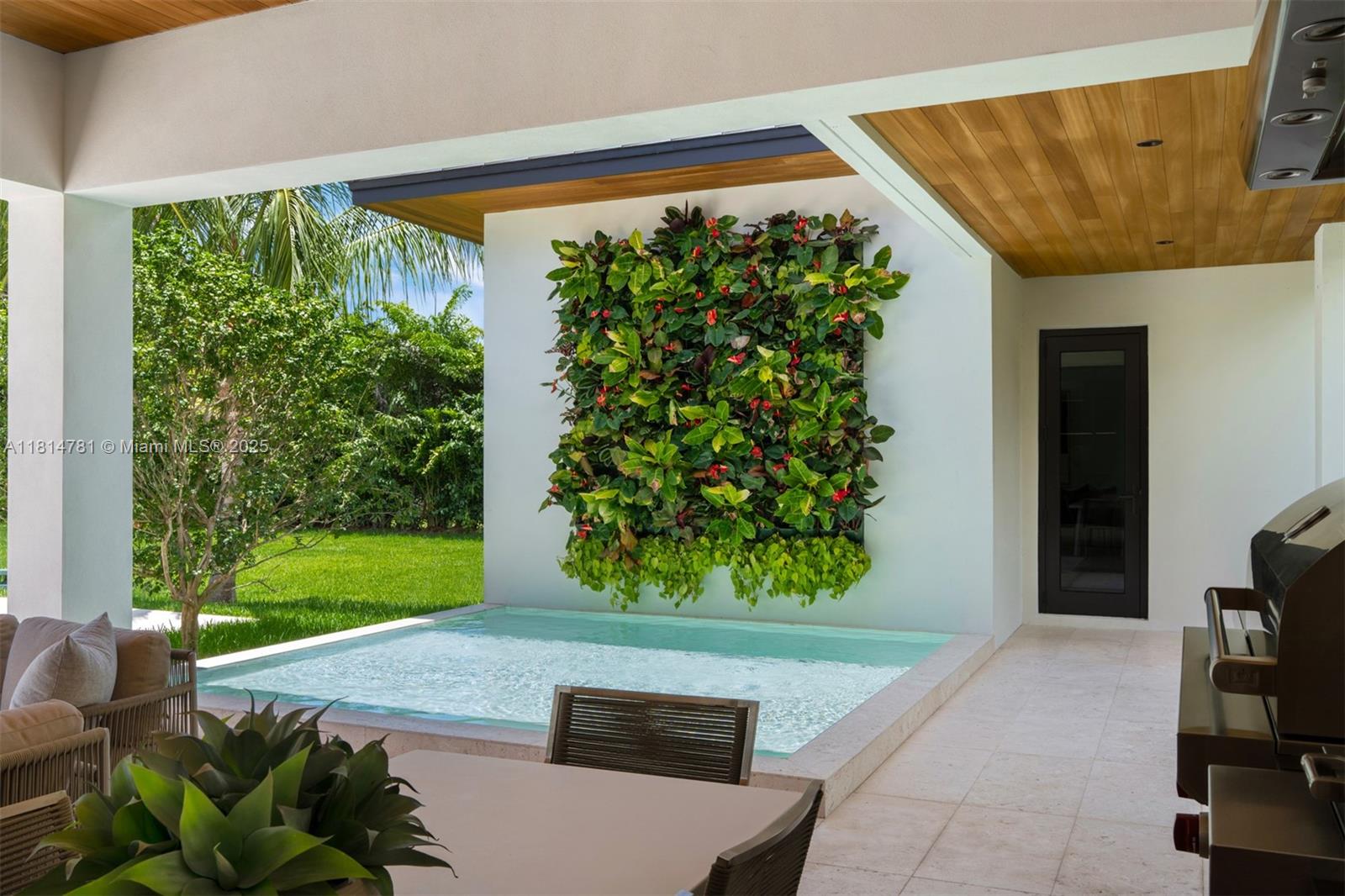 6730 Southwest 115th Street Pinecrest, FL 33156 - Photo 50 of 77 a front view of a house with garden