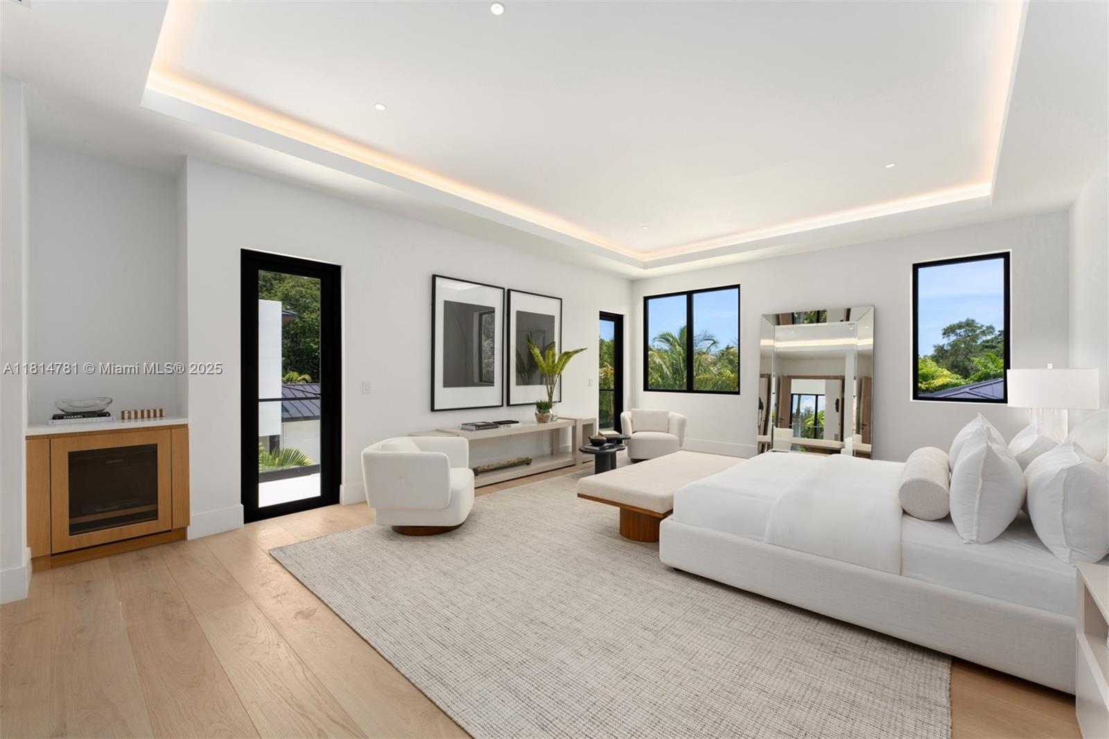 6730 Southwest 115th Street Pinecrest, FL 33156 - Photo 5 of 77 a bedroom with furniture and a fireplace