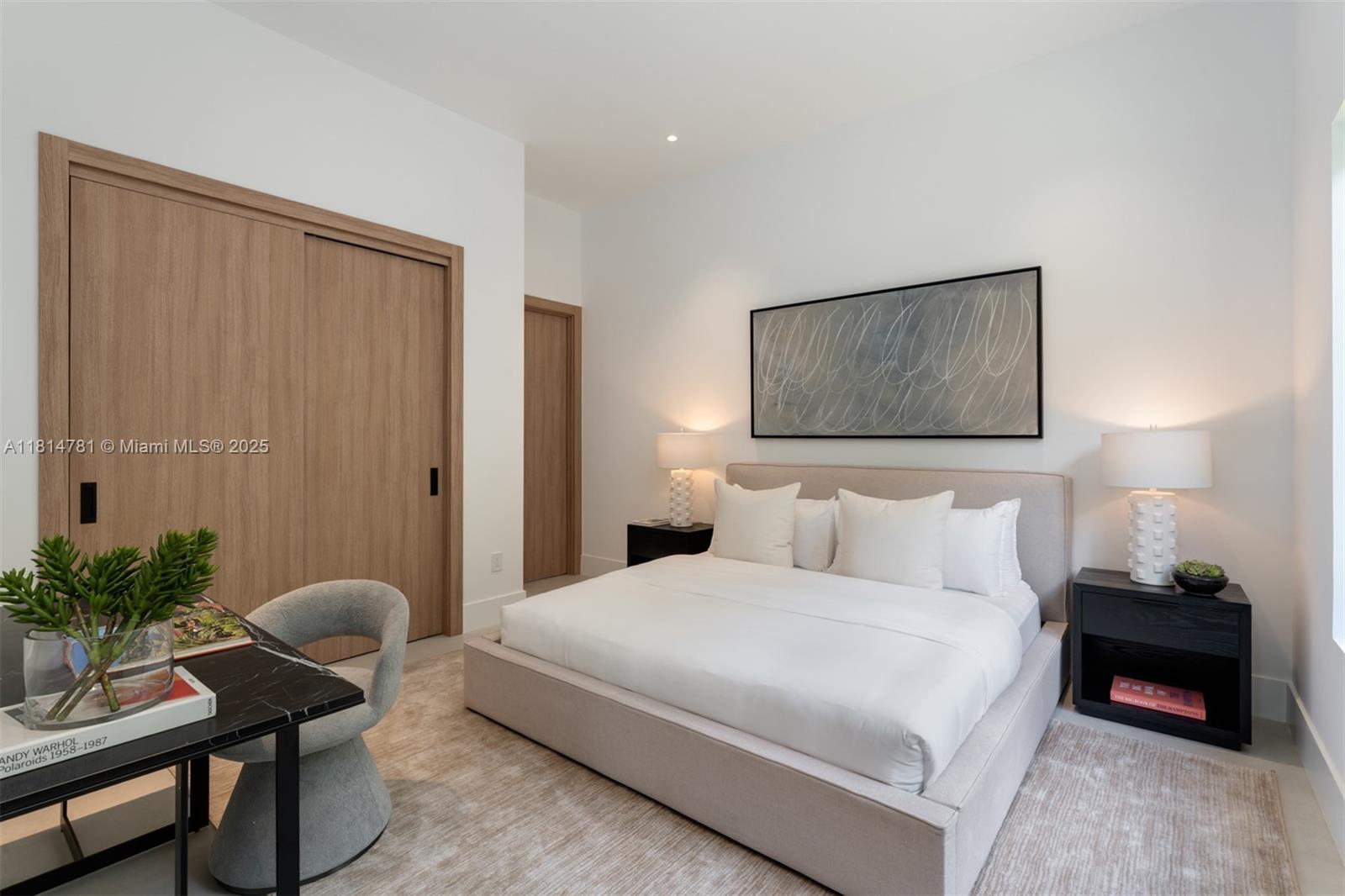 6730 Southwest 115th Street Pinecrest, FL 33156 - Photo 52 of 77 a bedroom with a bed and a potted plant