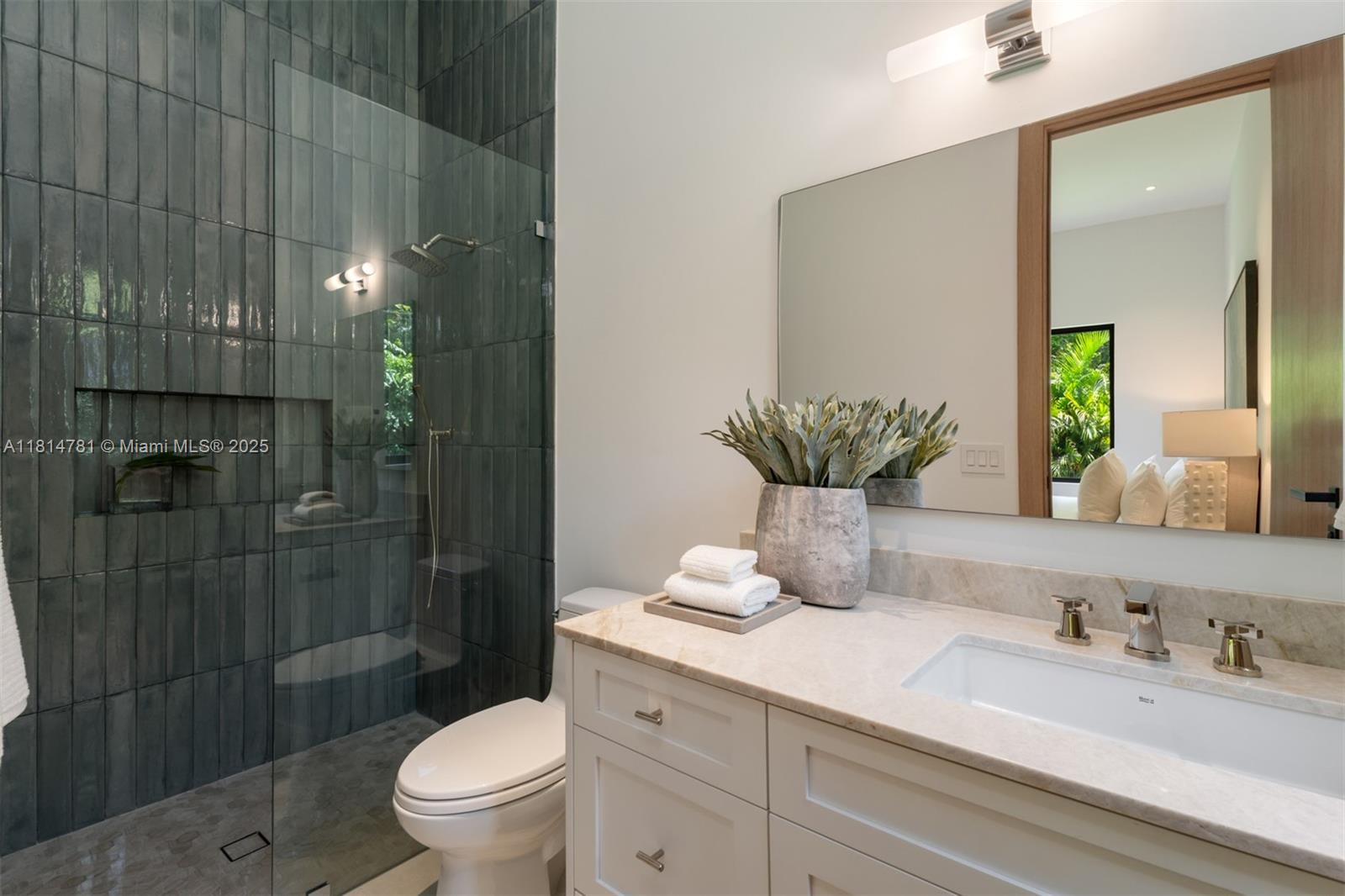 6730 Southwest 115th Street Pinecrest, FL 33156 - Photo 53 of 77 a bathroom with a granite countertop sink a toilet and shower