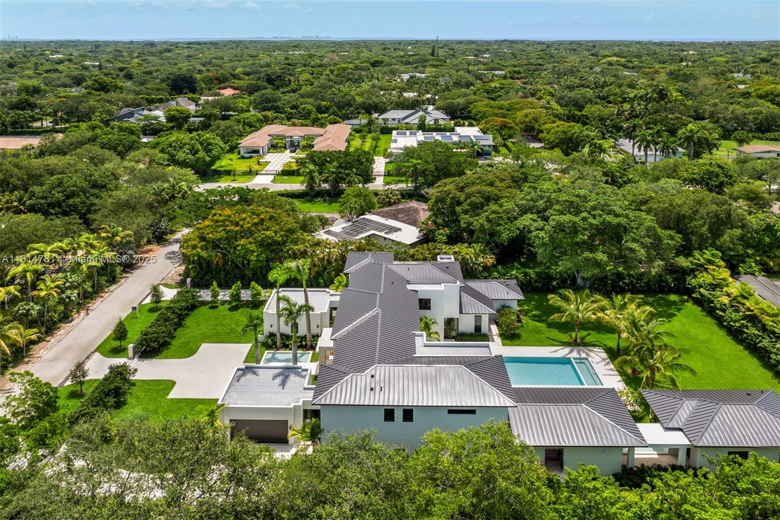 6730 Southwest 115th Street Pinecrest, FL 33156 - Photo 63 of 77 an aerial view of residential houses with outdoor space and street view