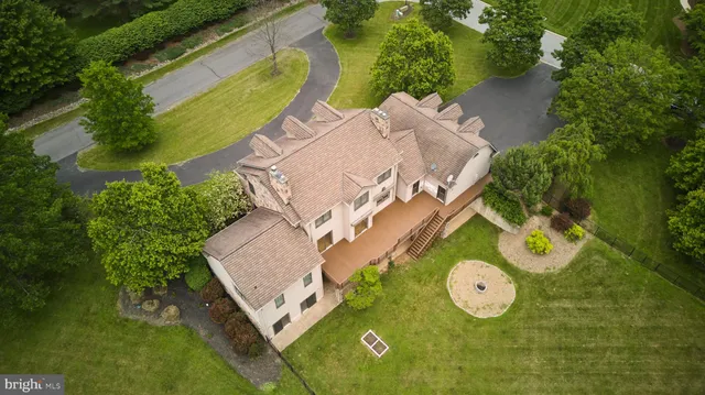 a kitchen with granite countertop a stove a sink and a microwave