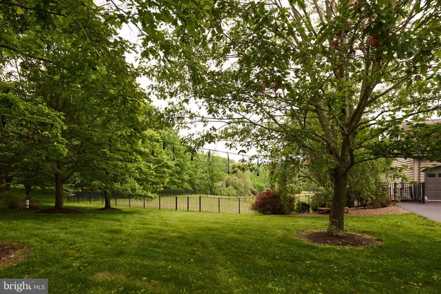a kitchen with stainless steel appliances granite countertop a sink and a counter space