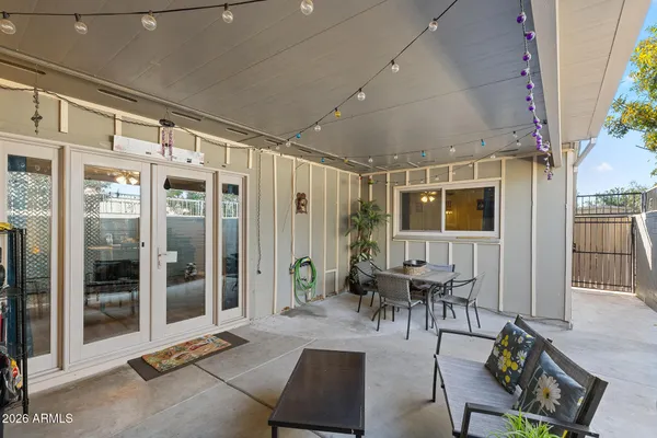 a outdoor space with lots of furniture and a glass door
