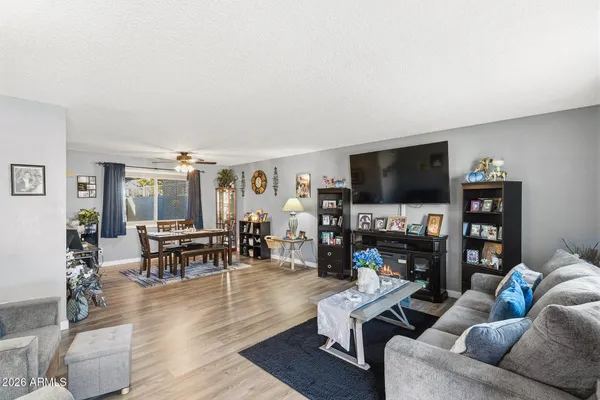 a living room with fireplace furniture and a flat screen tv