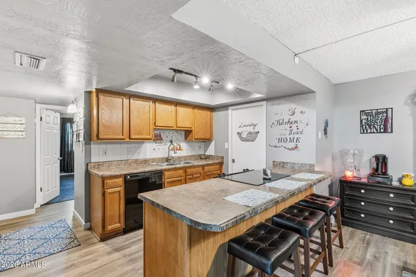 a view of a dining room with furniture and window