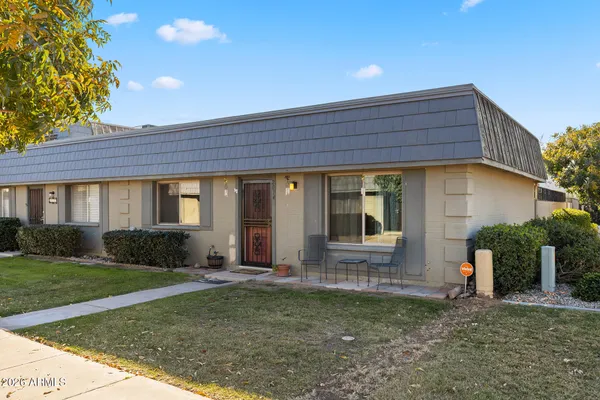 a view of house with backyard