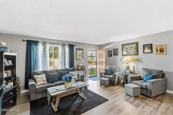 a living room with furniture and a window