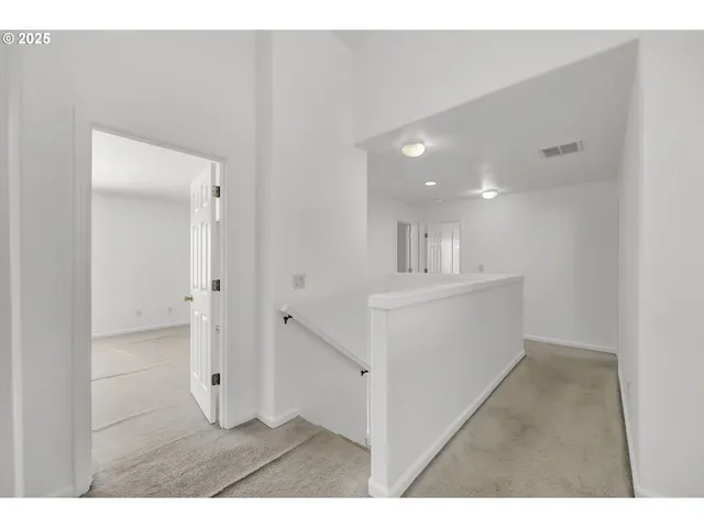 a bedroom with a bed and glass window