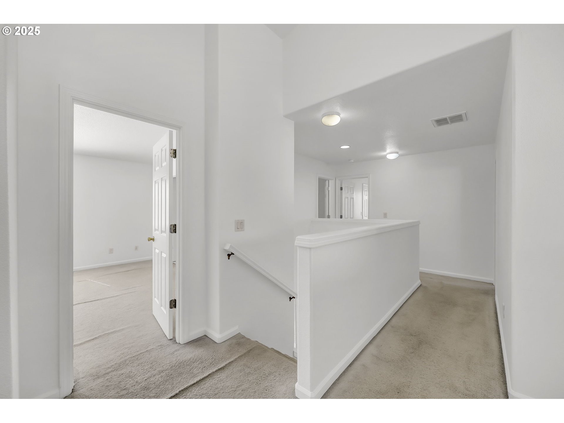 3906 Century Drive Eugene, OR 97402 - Photo 15 of 33 a view of a hallway with kitchen and wooden floor