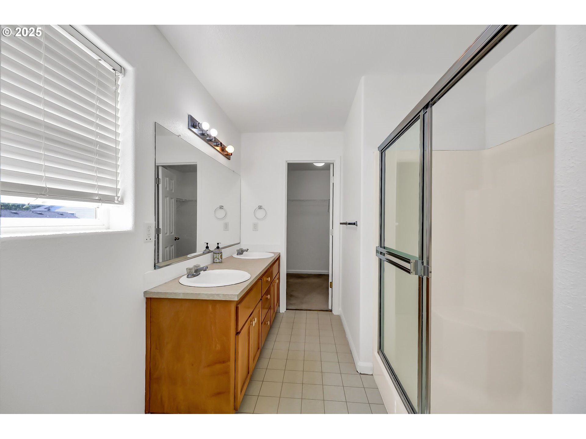 3906 Century Drive Eugene, OR 97402 - Photo 19 of 33 a bathroom with a sink mirror and a shower