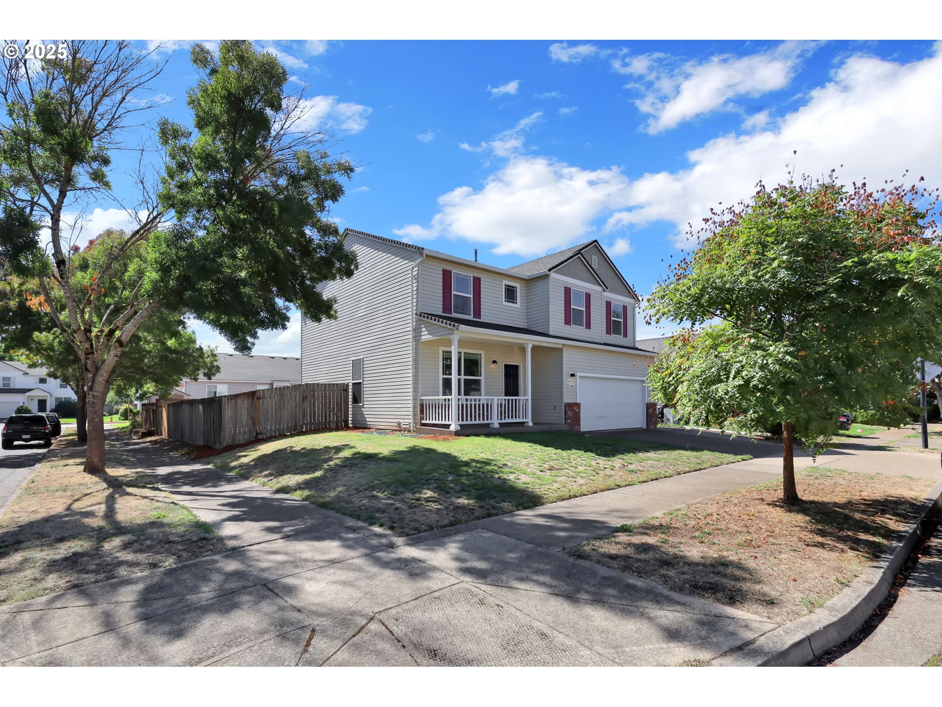 3906 Century Drive Eugene, OR 97402 - Photo 2 of 33 a view of a big house with a big yard and large trees