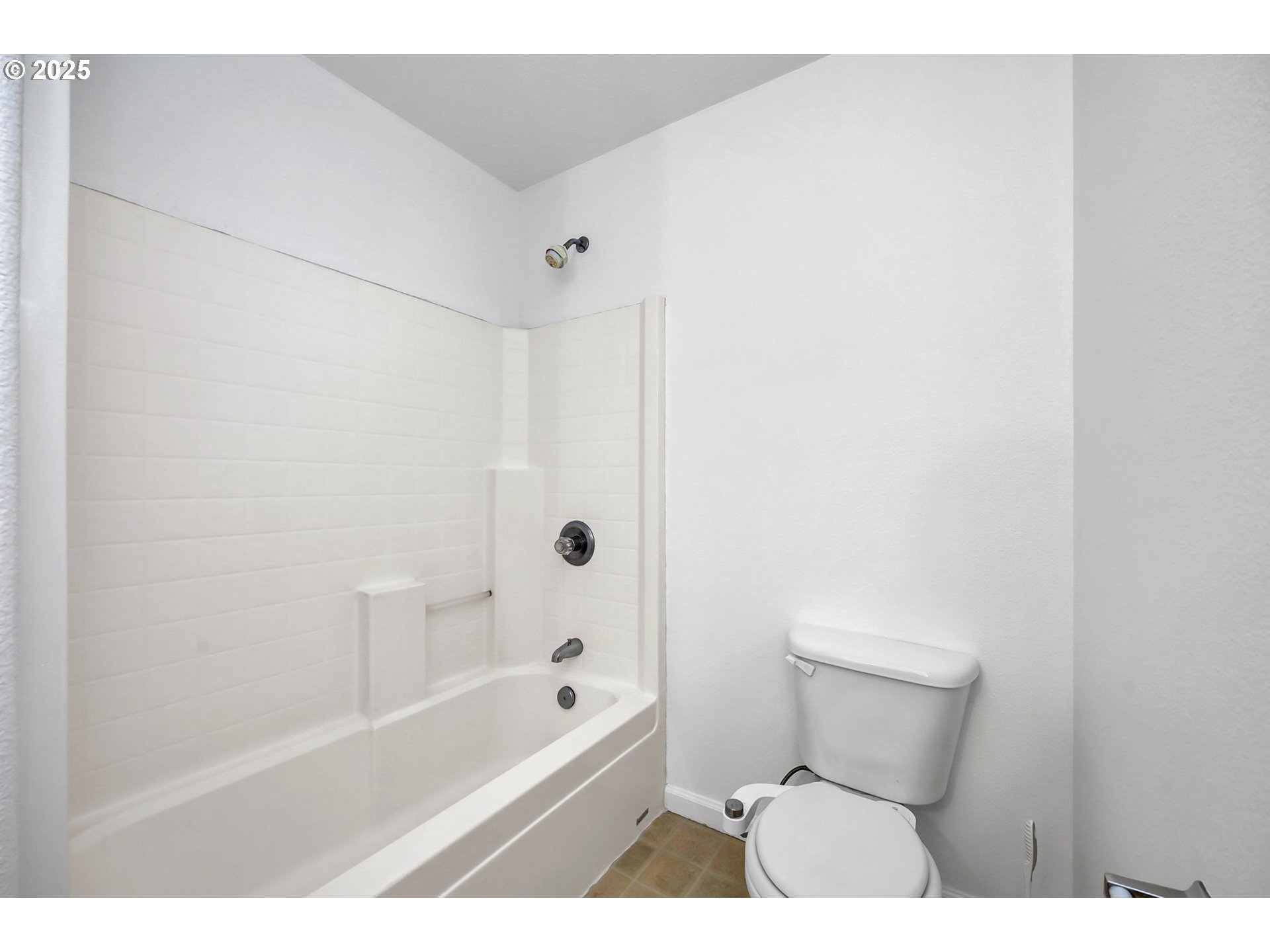 3906 Century Drive Eugene, OR 97402 - Photo 26 of 33 a bathroom with a toilet and a bathtub