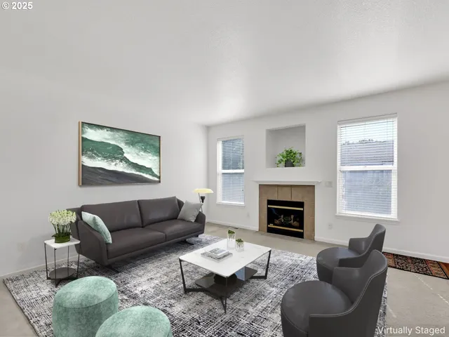 a view of a livingroom with an empty space and a fireplace