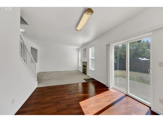 a kitchen with stainless steel appliances granite countertop a sink refrigerator and cabinets