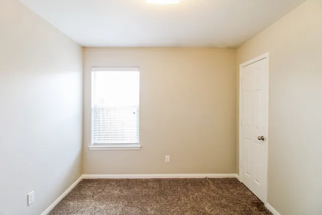 a view of a room that has a window in it