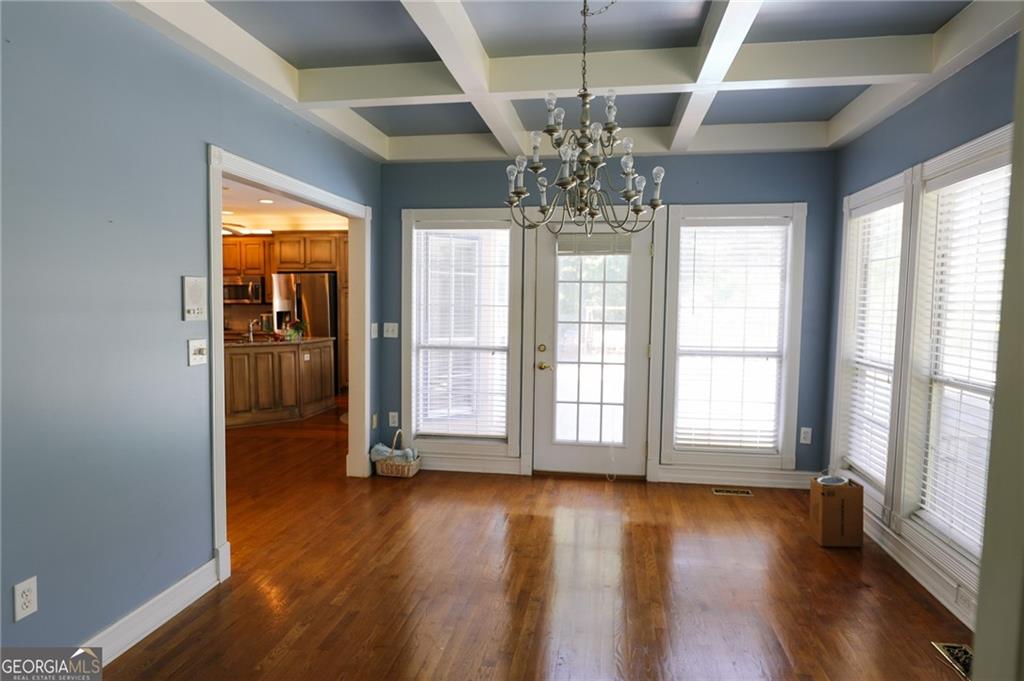7404 Golfers Villa Rica, GA 30180 - Photo 15 of 43 a view of an empty room with wooden floor and a window