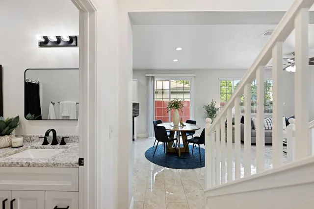 a view of living room with furniture and wooden floor