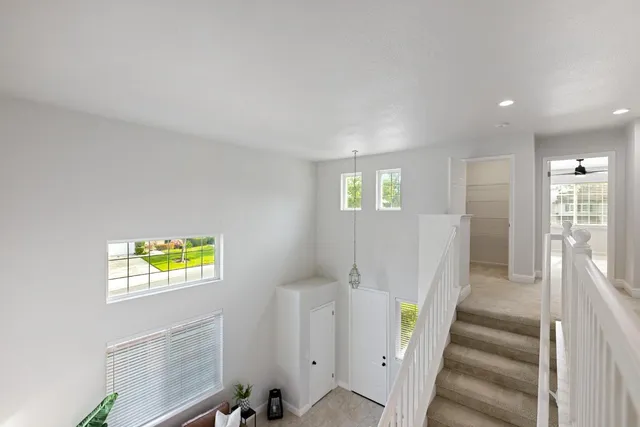 a view of an entryway with wooden floor