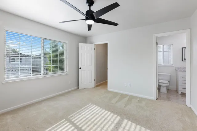 a view of livingroom with a ceiling fan and window