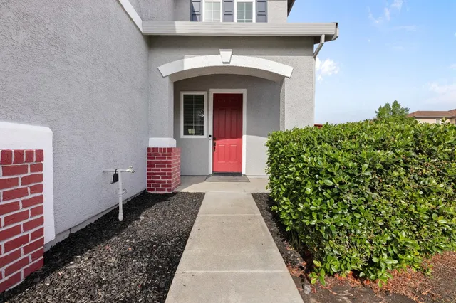 a front view of a house with a yard