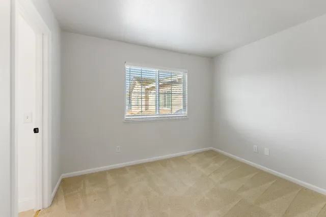 a view of a hallway with washer and dryer