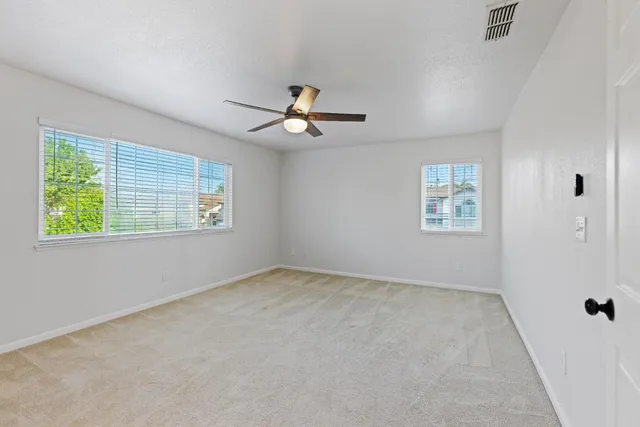 a spacious bathroom with a double vanity sink shower and mirror