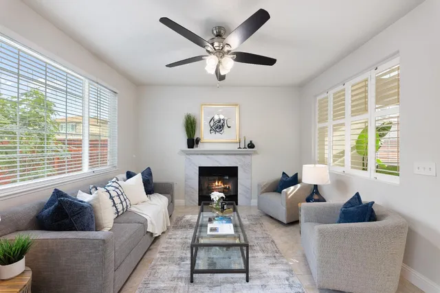 a living room with furniture and a fireplace