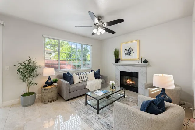 a living room with furniture and a fireplace