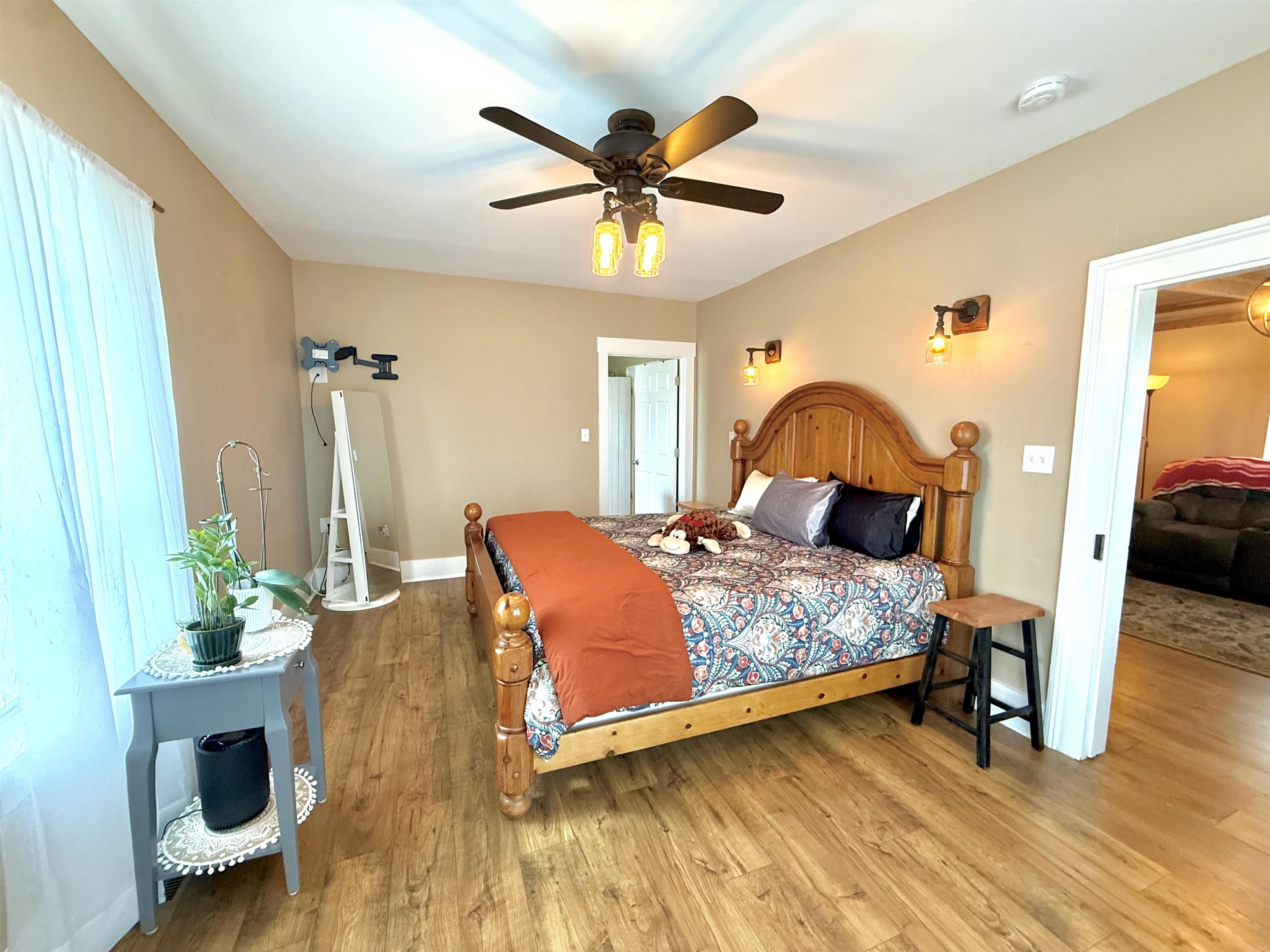 15385 Evergreen Valley Road Timberville, VA 22853 - Photo 16 of 44 a bedroom with a bed and wooden floor