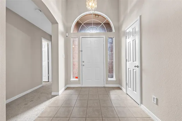 a view of a hallway to rooms