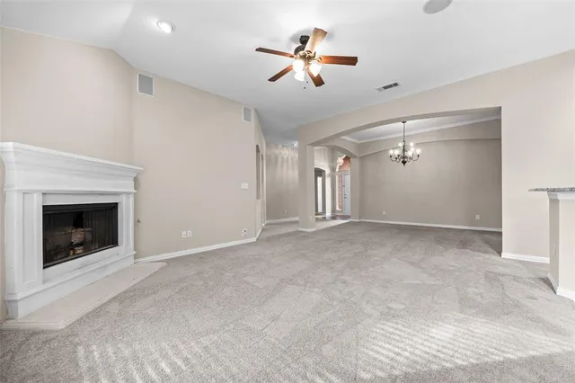 a view of an empty room with a fireplace