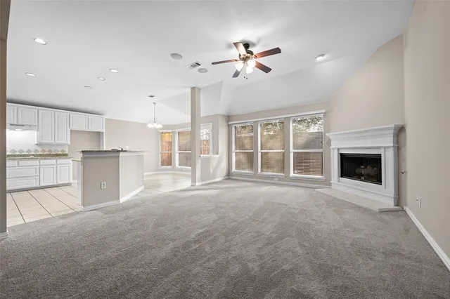 a view of a kitchen with a sink and a fireplace